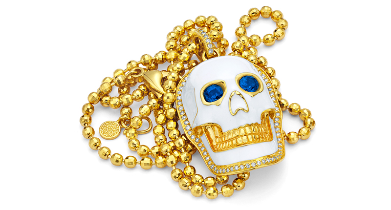 <a href="http://www.buddhamama.com" target="_blank" rel="noopener">Buddha Mama</a> 20-karat gold and white enamel skull pendant set with blue sapphire eyes ($9,000)
