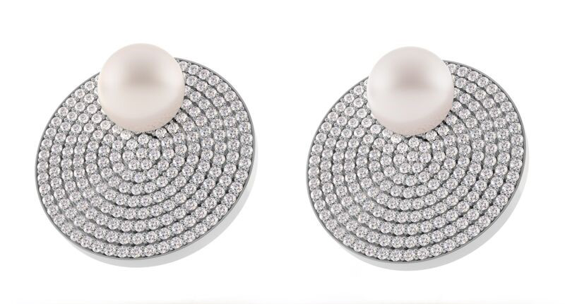 <a href="http://www.spinellikilcollin.com" target="_blank" rel="noopener noreferrer">Spinelli Kilcollin</a> Saturn earrings featuring South Sea pearls and pave-set white diamonds in 18-karat white gold ($15,000)