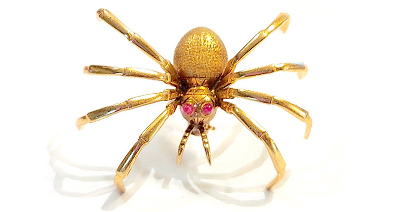 <a href="https://www.normawellingtondesigns.com" target="_blank" rel="noopener">Norma Wellington Designs</a> 14-karat gold spider with ruby eyes ($900)