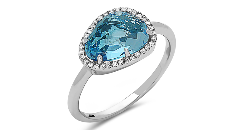 <a href="http://www.dilamani.com/blue-topaz-ring-pid-AR81620BT-820W.html" target="_blank" rel="noopener noreferrer">Dilamani</a> 14-karat gold ring with an asymmetrical Swiss blue topaz and diamond halo ($1,140)