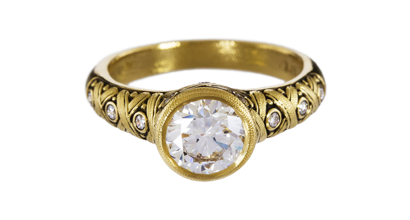 <a href="twistonline.com" target="_blank" rel="noopener noreferrer">Alex Sepkus for Diamond Foundry x Twist</a> 18-karat yellow gold diamond crisscross solitaire ring with a lab-grown white diamond from the Diamond Foundry at center ($12,555)