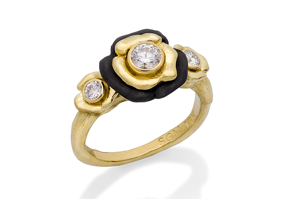 Sarah Graham’s “Bee Three Flower” ring in 18-karat yellow gold and oxidized cobalt chrome with white diamonds ($5,165) <a target="_blank" href="http://sarahgraham.com/"><span style="color: #ff0000;">SarahGraham.com</span></a>