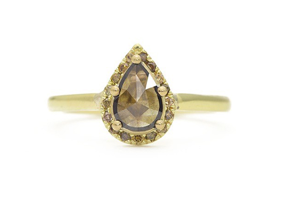 A deep autumn-colored rose-cut diamond is surrounded by round diamonds in Tura Sugden’s understated halo ring, with the diamond partially tucked under the solitaire setting to allow for a subtle shimmer set in 18-karat yellow gold ($6,095). <a href="http://www.turasugden.com/" target="_blank"><span style="color: rgb(255, 0, 0);">turasugden.com</span></a>