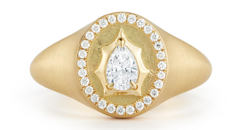 This show-stopping signet ring features a pear-shaped diamond, representing “The Envoy” personality type. 
