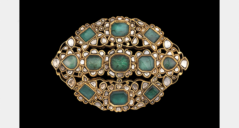 This 19th century emerald and diamond-set enameled belt buckle from north India could garner as much as $35,000.