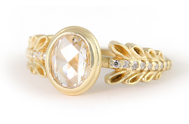 Megan Thorne’s “Marina Garland” ring in 18-karat yellow gold with an oval rose-cut diamond center and diamond accent stones ($8,850) <a href="http://www.meganthorne.com/" target="_blank"><span style="color: rgb(255, 0, 0);">MeganThorne.com</span></a>