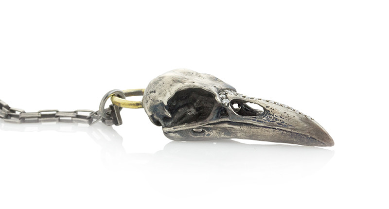 <a href="https://www.jamiejoseph.com" target="_blank" rel="noopener">Jamie Joseph </a>oxidized sterling silver and brass necklace with raven skull and diamond pave beak ($1,180)