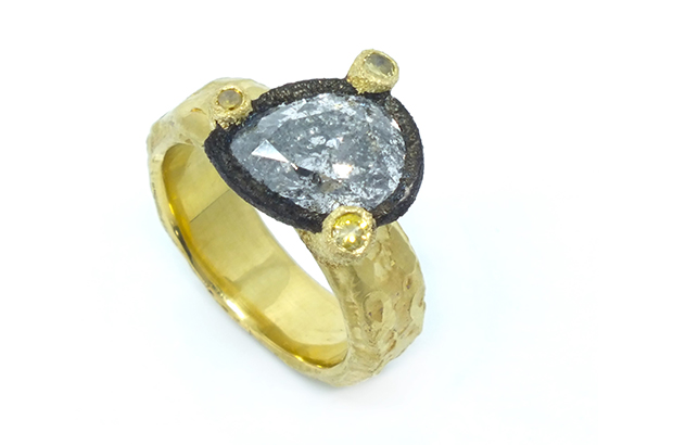 Todd Pownell set this pear-shaped diamond in a darkened 14-karat white bezel with three large 18-karat yellow prongs, each set with a yellow diamond ($9,960). <a href="http://www.tapbytoddpownell.com/" target="_blank"><span style="color: rgb(255, 0, 0);">TapByToddPownell.com</span></a>