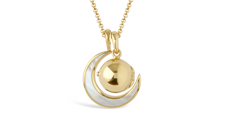 <a href="https://www.dinnyhall.com/" target="_blank" rel="noopener noreferrer">Dinny Hall</a> personalized “My World” locket and moon charm with mother-of-pearl inlay in yellow gold vermeil ($315)