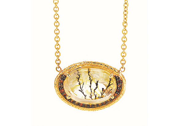 This dendritic quartz and brown diamond pendant is made by Susan Wheeler ($5,620).<br />
<a target="_blank" href="http://www.susanwheelerdesign.com/"><span style="color: #ff0000;">susanwheelerdesign.com</span></a>