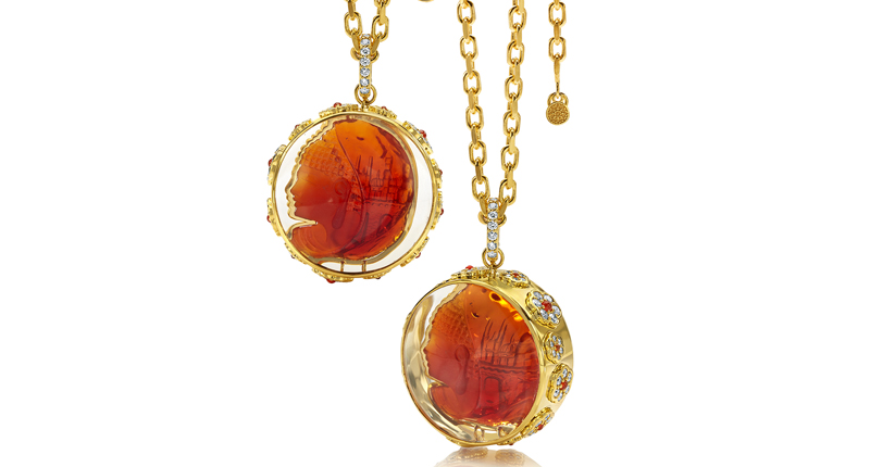 Buddha Mama’s 20-carat fire opal Buddha necklace set in crystal dome globe with diamonds and carnelian