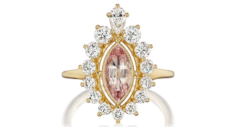 <strong>First place in jewelry from $5,001 to $10,000, retailer:</strong> Designed by Mary Herouvis of Greenwich St. Jewelers in New York, New York. A 14-karat yellow gold ring with 1.33-carat marquise faceted padparadscha sapphire with graduating round diamonds (1.12 total carats)