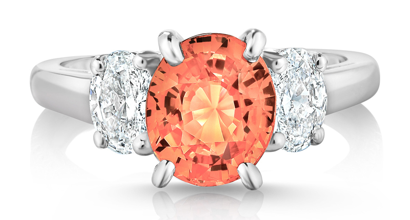 Pictured here is Oscar Heyman’s 2.59-carat padparadscha sapphire ring with two oval diamonds totaling 0.78 carats, set in platinum