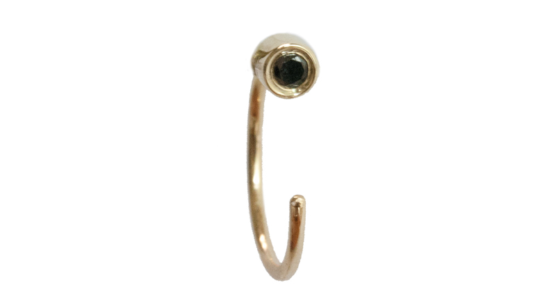 Meredith Marks’ “Lila Huggie” in 14-karat yellow gold with black diamonds earring around the lobe of the ear ($200)<br /><a href="http://www.meredithmarks.com" target="_blank">MeredithMarks.com</a>