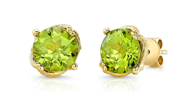 These are Loretta Castoro’s “Love Doves” stud earrings featuring two round peridot stones weighing 3.80 carats total, set in 18-karat yellow gold ($1,650).