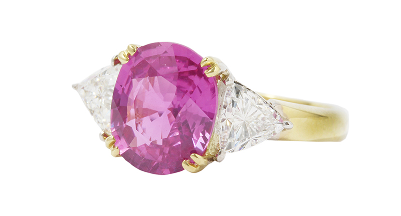 From Bernard Nacht & Company’s Under the Crown estate jewelry collection is this ring featuring a 4.04-carat cushion shape purplish pink sapphire with two trillion shape diamonds weighing 1.10 carats and set in 18-kart yellow gold ($25,000).
