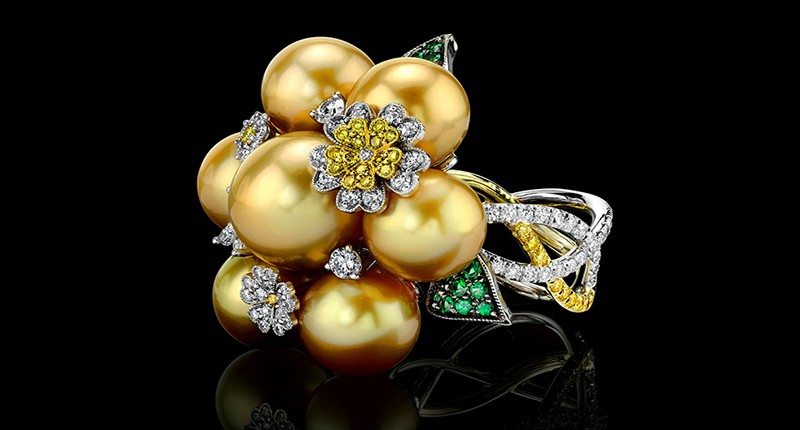 <strong>First place in jewelry from $2,001 to $5,000, supplier:</strong> Designed by Jack Ferrero of Jack Ferrero Inc. in Los Angeles, California. An 18-karat white and yellow gold ring with fancy yellow and white brilliant-cut diamonds, green garnet and South Sea golden pearls