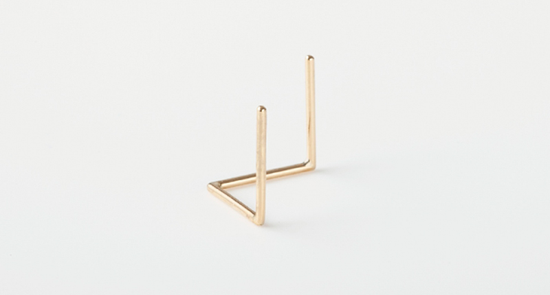 Ishihara has created a series of earrings that rely on their own architectural twists and turns to stay securely in the ear, rather than a post. This style, comprised of 18-karat yellow gold, retails for $310.
