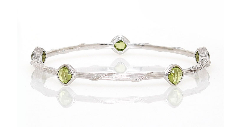 This bangle from Ariva features checkerboard-faceted peridot stones set in sterling silver ($475).