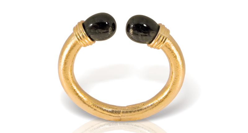 Ilias Lalaounis’ Neolithic bracelet in hand-hammered yellow gold with onyx egg-shaped stones ($22,200) <br /><a href="http://www.IliasLalaounis.eu" target="_blank">IliasLalaounis.eu</a>