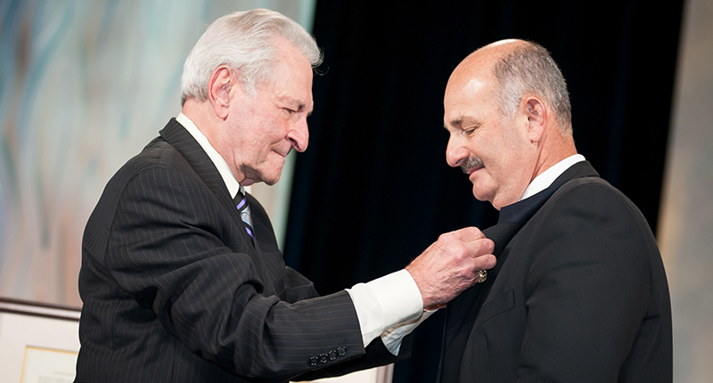 Altobelli pinning Bill Boyajian at AGS Conclave in 2013 when Boyajian won the Shipley Award. Altobelli said he attended 50 consecutive Conclaves, from 1969 until the last one in 2019. (There was no Conclave in 2020 due to the pandemic.)