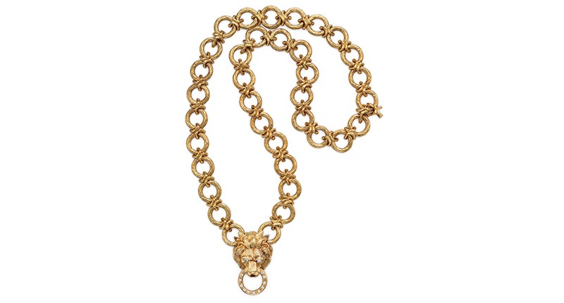 The matching Van Cleef lion pendant-brooch necklace with 18-karat gold and diamonds, worn on the same occasion, went for $56,250.