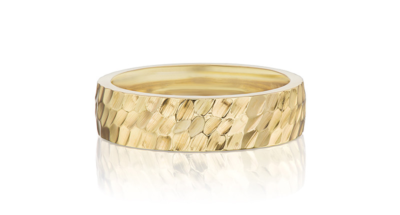 <a href="https://danabronfman.com/products/classic-wide-hammered-band" target="_blank" rel="noopener">Dana Bronfman</a> 18-karat Fairmined gold classic wide hammered band ($3,235)
