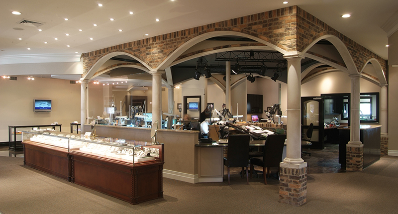 The setup of David Gardner’s Jewelers & Gemologists gives customers a peek into the design process, with the retailer’s bench jewelers seated in an open design studio located in the center of the store.