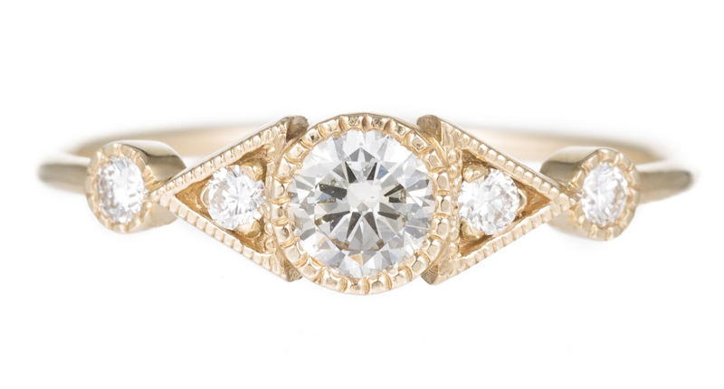 <a href="https://www.jenniekwondesigns.com" target="_blank" rel="noopener">Jennie Kwon</a> Diamond Duo Deco Spear Ring in 14-karat yellow gold with white diamonds ($1,560)