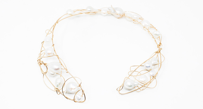 <p><a href="http://www.marymacgill.com" target="_blank" rel="noopener">Mary MacGill</a> woven pearl collar and gold-filled wire necklace ($925) </p>