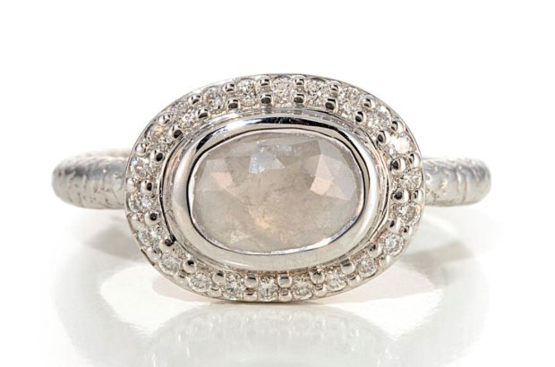 Susan Wheeler’s gray diamond ring features a 1.03-carat center stone surrounded with white diamond pave set in 18-karat white gold ($2,480).<br />
<a href="http://www.susanwheelerdesign.com/" target="_blank"><span style="color: #ff0000;">SusanWheelerDesign.com</span></a>