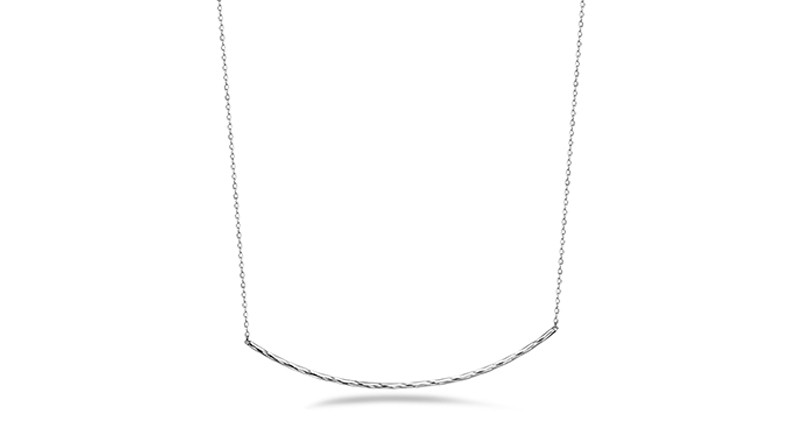 The Sunrise Bar necklace features a curved, platinum bar floating in the center, connected by a platinum chain that can be adjusted in length from choker to 18 inches ($650)