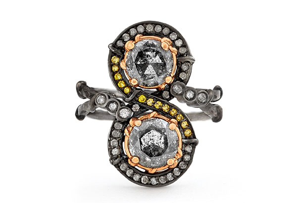 The Black Swan Infinite ring from Karen Karch features two gray diamonds set in 18-karat rose gold, surrounded by gray and intense yellow diamonds set in blackened 18-karat white gold ($11,500).<br />
<a href="http://www.karenkarch.com/" target="_blank"><span style="color: #ff0000;">KarenKarch.com</span></a>