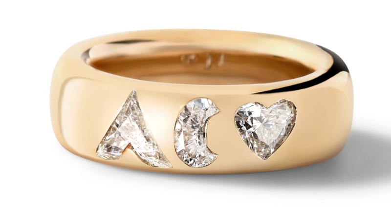 This wedding band features diamond initials, “A” and “C,” and a heart-shaped diamond.