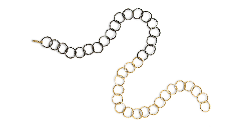 <a href="http://www.danabronfman.com" target="_blank" rel="noopener noreferrer">Dana Bronfman</a> “Half-Dipped Loop” necklace in black rhodium-plated sterling silver and 18-karat yellow gold hammered links and clasp with single diamond ($4,890). The clasp can hook onto any link, allowing this style to be worn in multiple lengths as a Y-necklace, with the gold in front, black in front or showing off both colors simultaneously.