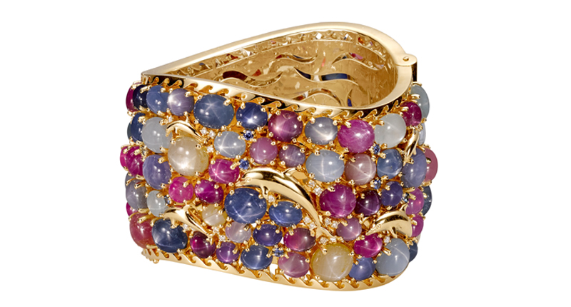 “The Baiji Dolphin” bracelet is comprised of 18-karat yellow gold with Burmese star ruby, Ceylon star sapphire and diamond