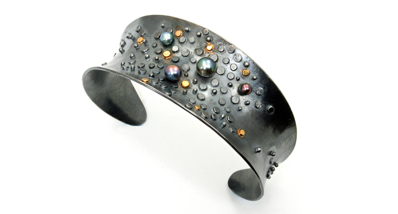 Sydney Lynch’s “Tide Pool” cuff featuring 18-karat gold and oxidized silver with dyed black pearls ($880)