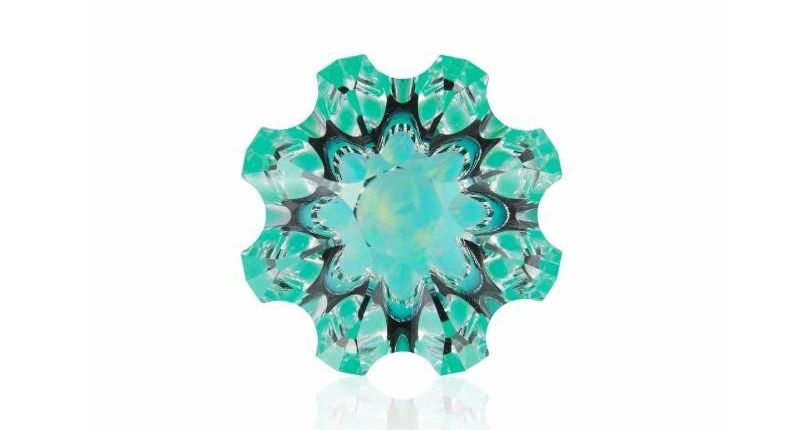 <strong>Innovative Faceting.</strong> A 32.75-carat specialty-cut quartz with chrysoprase and opal from Christopher Wolfsberg won first place in this category.