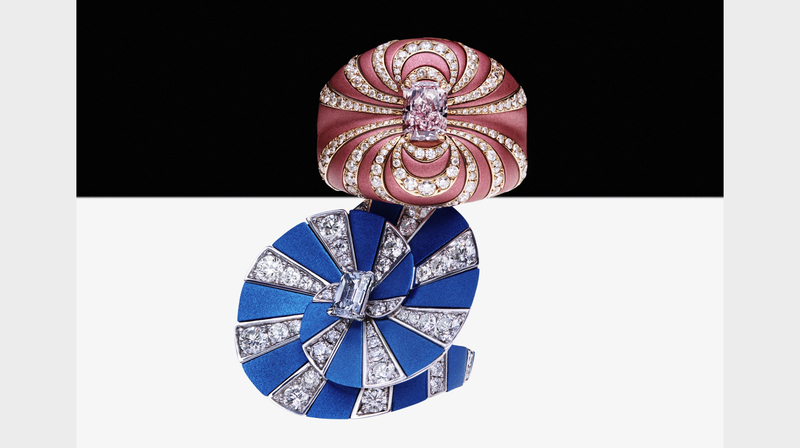 The pink ring made of aluminum and 18-karat rose gold features a 1.01-carat radiant-cut fancy intense pink diamond. The blue ring in aluminum and 18-karat white gold has a 0.5-carat emerald-cut fancy intense blue diamond.