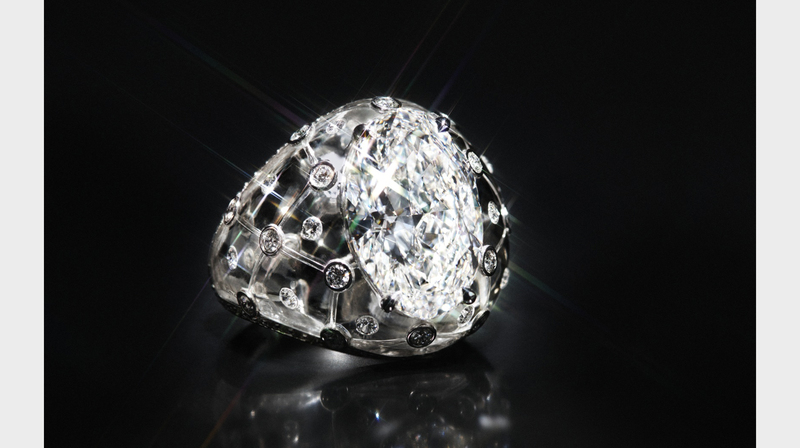 In this bombe ring, an 8.24-carat oval-shaped diamond is set within a single piece of rock crystal.