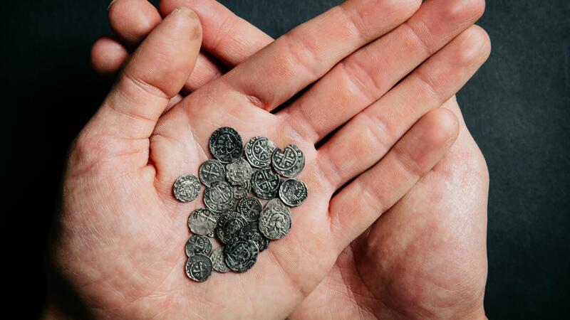 The coins found alongside the jewelry helped to determine how old the treasure was, said the museum. (Photo © Archeology West-Friesland/Fleur Schinning)