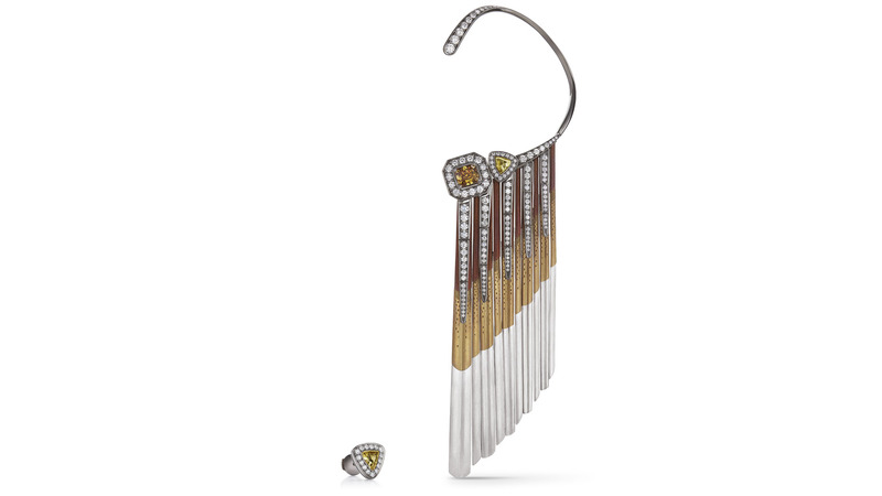 The Light Rays Ear Cuff features a 1-carat fancy deep brownish yellow radiant-cut diamond with bands of titanium undulating toward the shoulder.