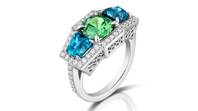 <b>Best Use of Platinum and Color.</b> Mary van der Aa of Mary van der Aa’s platinum “Aria” ring featuring a 2.10-carat demantoid garnet accented with blue zircons (3 total carats) and diamonds