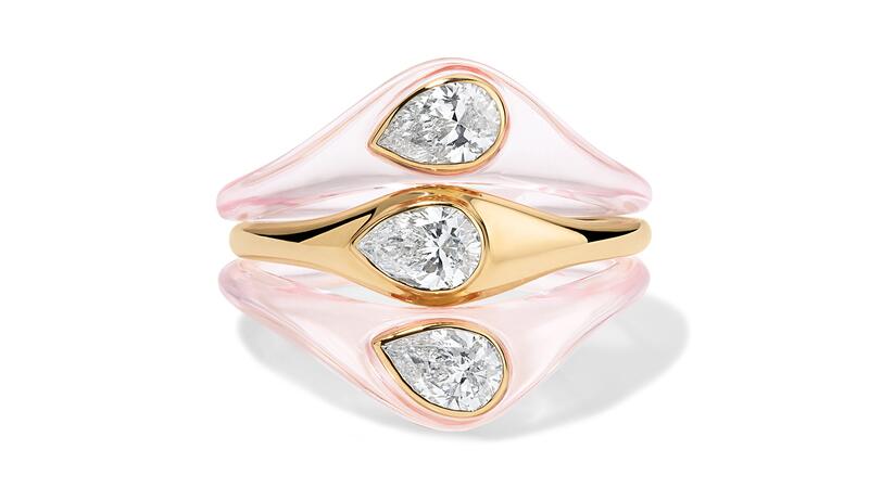 The “Triad” ring set includes three rings with pear-shaped lab-grown diamonds; two rings are in “Rose Claire” resin and one is 14-karat yellow gold ($3,345) Alison Lou Lumière Triad Ring Set
