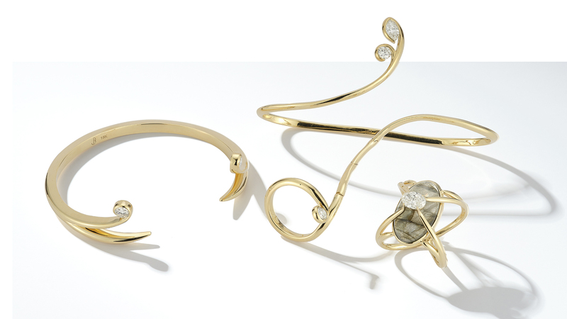 The pieces in Jules Kim’s “Compassion” collection include, from left, the “Passion” bangle in 18-karat gold with 0.60 carats of diamonds ($15,220 retail), the 18-karat gold “Median” handlet with three diamonds totaling 1.21 carats ($11,310) and the “Compass” ring in 18-karat gold. The Compass can be worn north-south or east-west and features a 1-carat diamond and a spectrolite, a variety of labradorite found only in Finland.