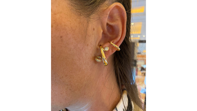 At Couture, Kim modeled one of her “Bolero” ear cuffs ($11,620), which can be worn multiple ways. They arch under the ear lobe, as seen here, or flip into the ear, and can be worn separately or stacked on one ear together.