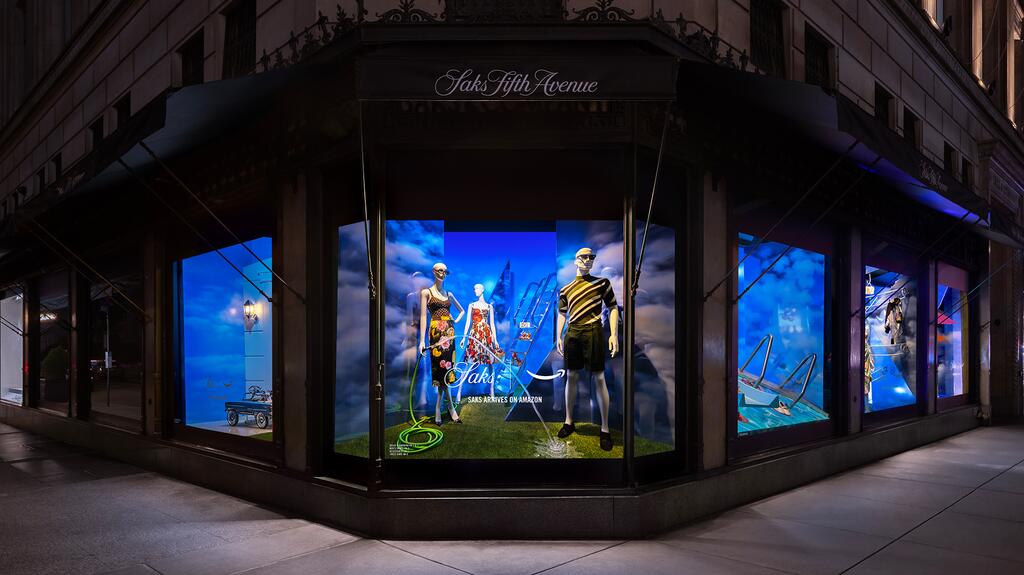 The Saks Fifth Avenue flagship in New York City has a window installation promoting “Saks on Amazon.” Saks Fifth Avenue New York window display