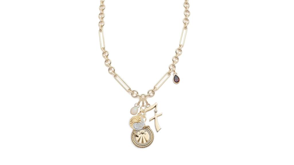 Foundrae’s “Mind, Body, Soul” mixed-clip story necklace in 18-karat yellow gold with five medallions including a 0.80-carat ruby, a 2.10-carat opal, and diamonds totaling 0.34 carats ($34,000) Foundrae Mind, Body, Soul Story Necklace