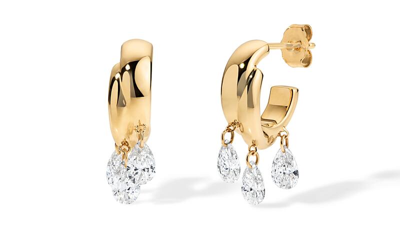 The “Twisted” hoops in 14-karat yellow gold with 0.28 carats of lab-grown diamonds that were drilled and attached via links ($3,905) Alison Lou Lumière Twisted Hoops