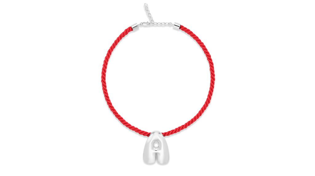 Alison Lou’s “Cloud” necklace features a silver letter on a red cord ($425) Alison Lou Cloud Necklace